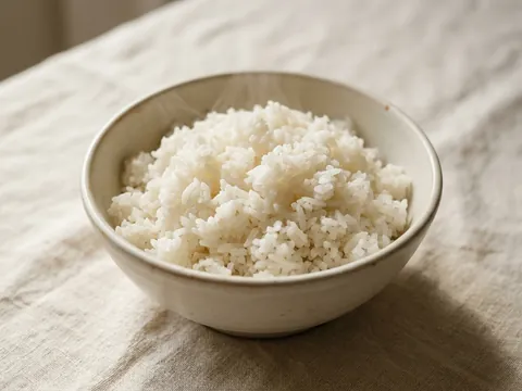 Illustration — a bowl of steamed jasmine rice.
